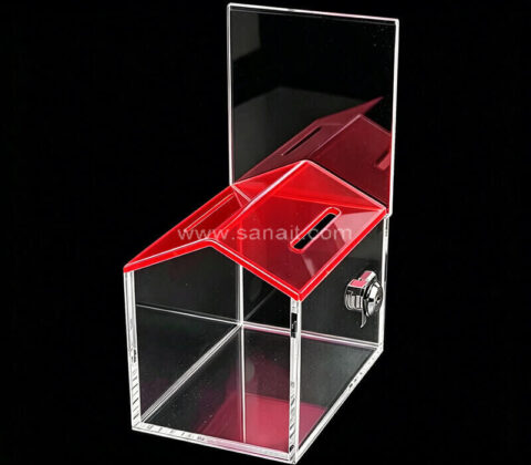 Spendenbox aus Acryl in Hausform mit rotem Dach